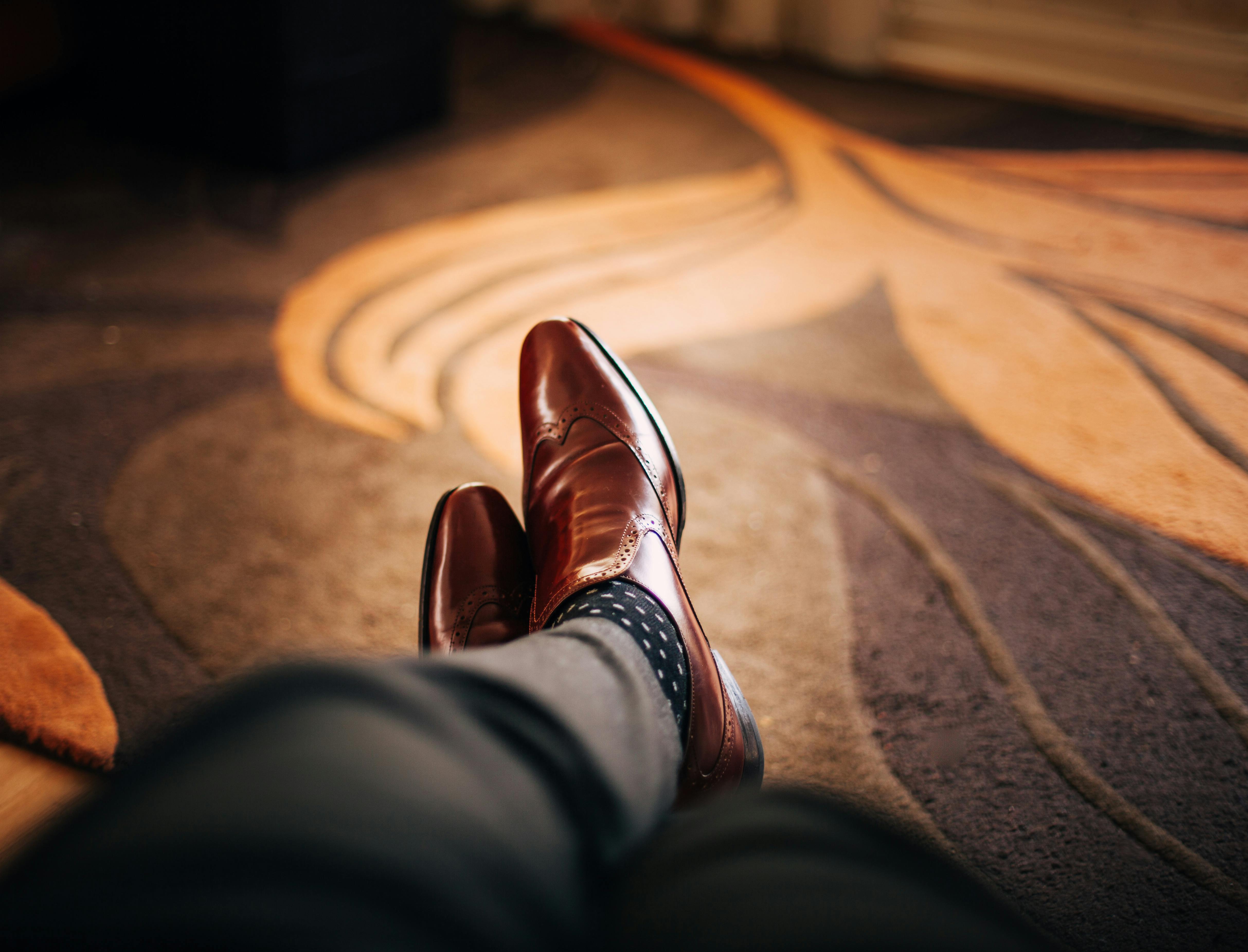 Shallow Focus Photography of Person Wearing Brown Leather Dress Shoes